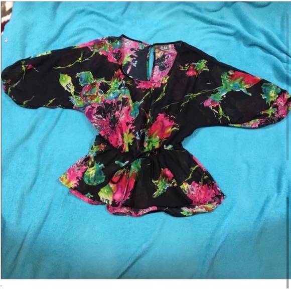 Free! Semi sheer crossover top with thin, elastic waistband and peplum hemline - Picture 2 of 9